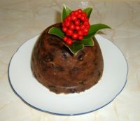 This Christmas pudding is decorated with skimmia rather than holly.