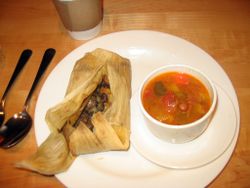 A meal of a tamale and squash soup