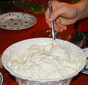 Rice pudding being served during the traditional Scandinavian Christmas meal, in Denmark